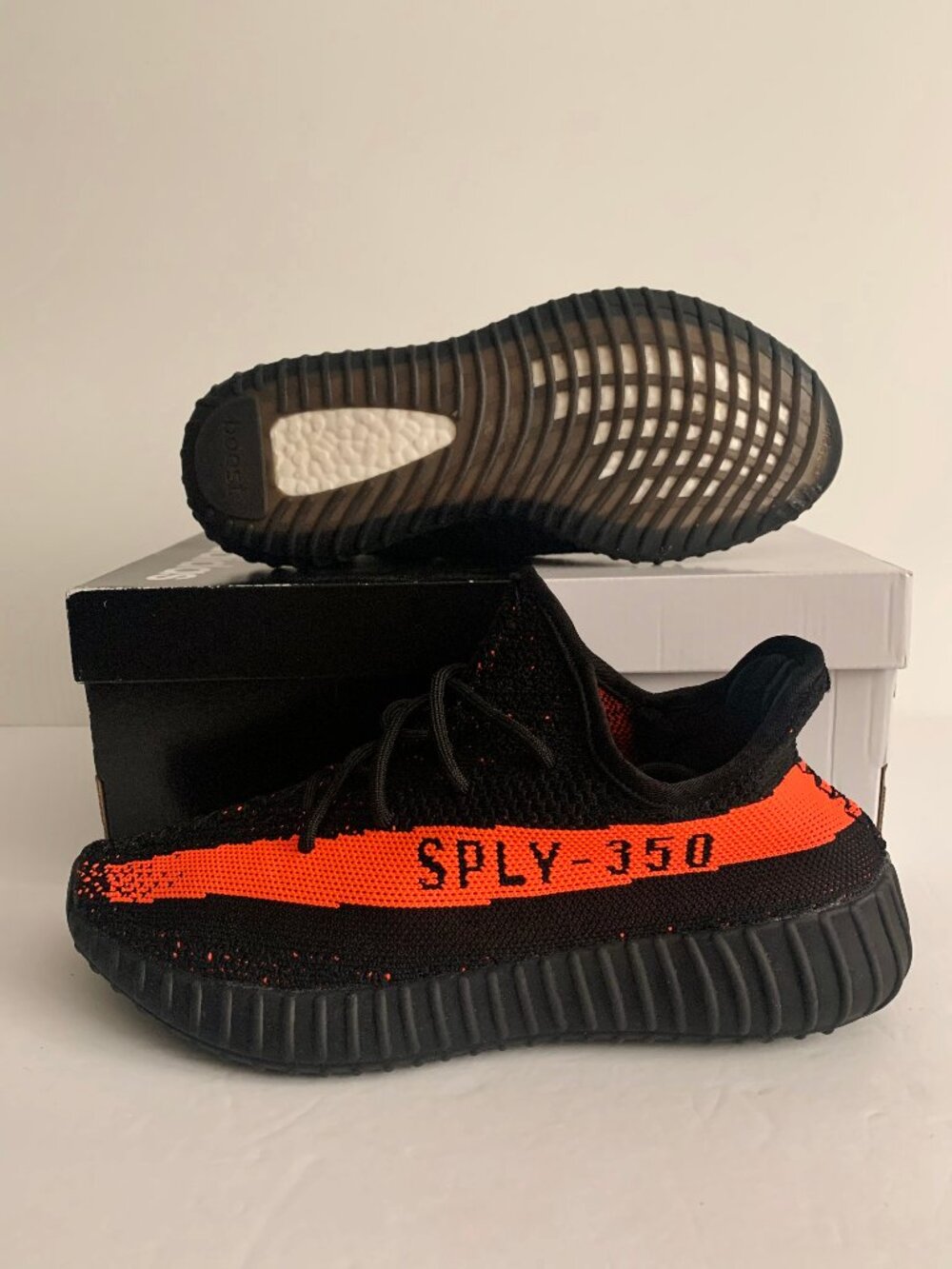 adidas men's Yeezy Boost 350 Black and Red Stripe Sneaker